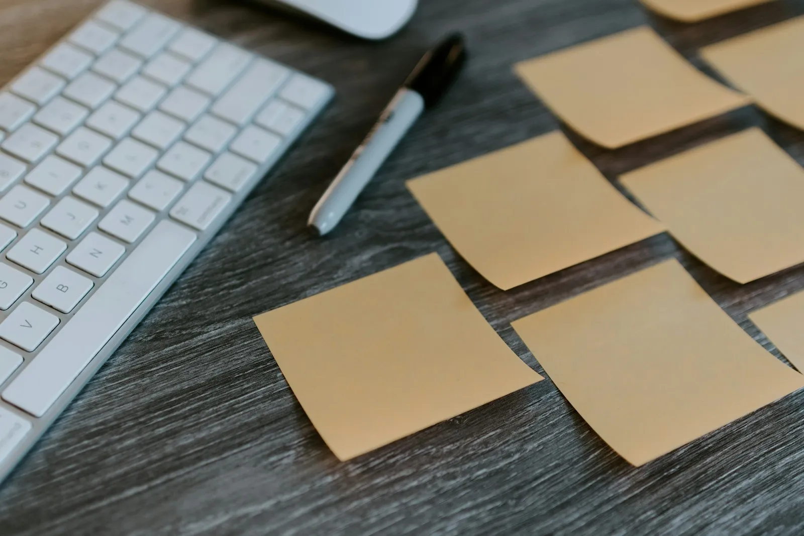 Single-page financial plan summary printed on a wood desk